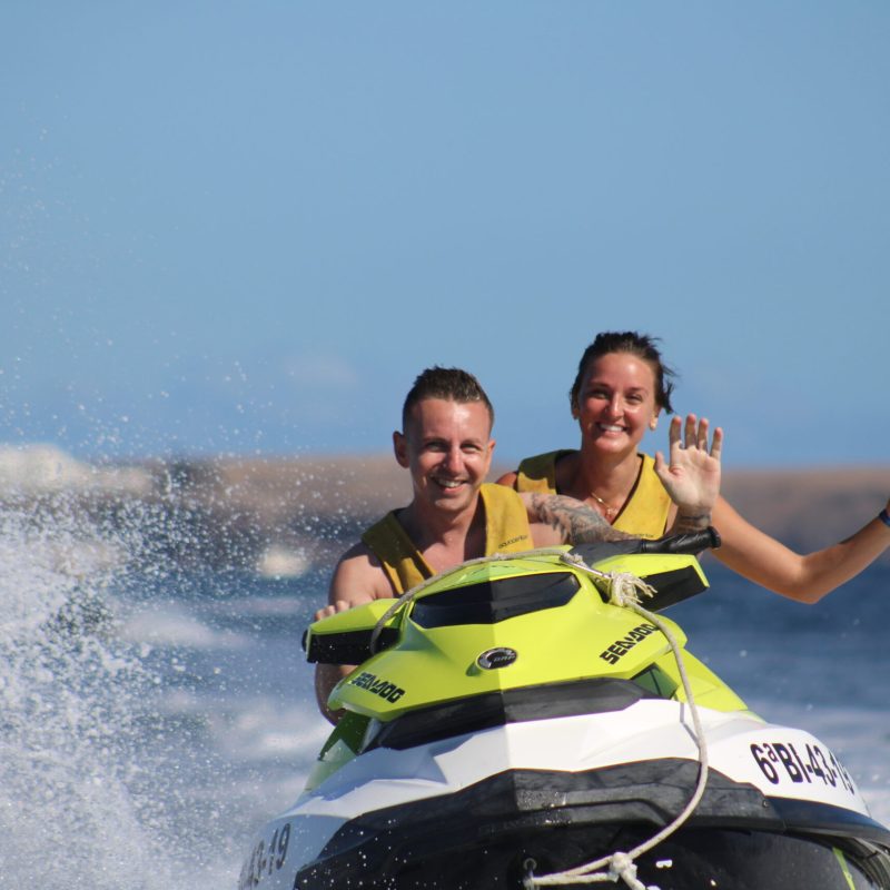 a man riding a wave on top of a body of water
