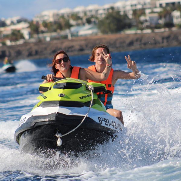a person riding a wave on top of a body of water