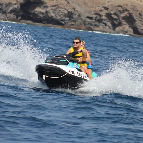 a man riding a wave on a surfboard in the water