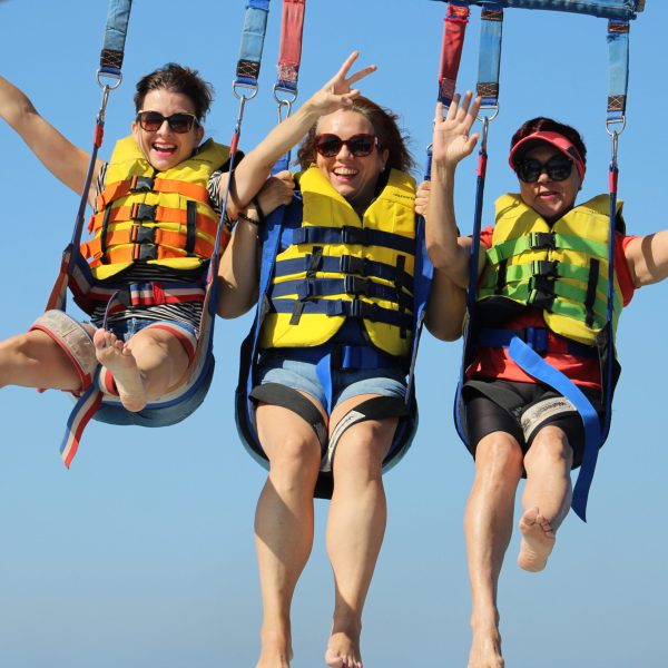 a group of people riding on the back of a boat
