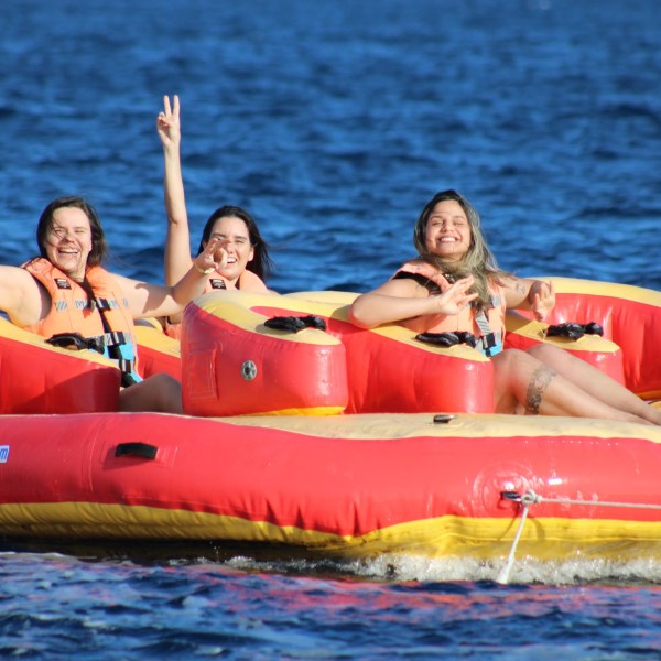 a group of people in a boat on a body of water