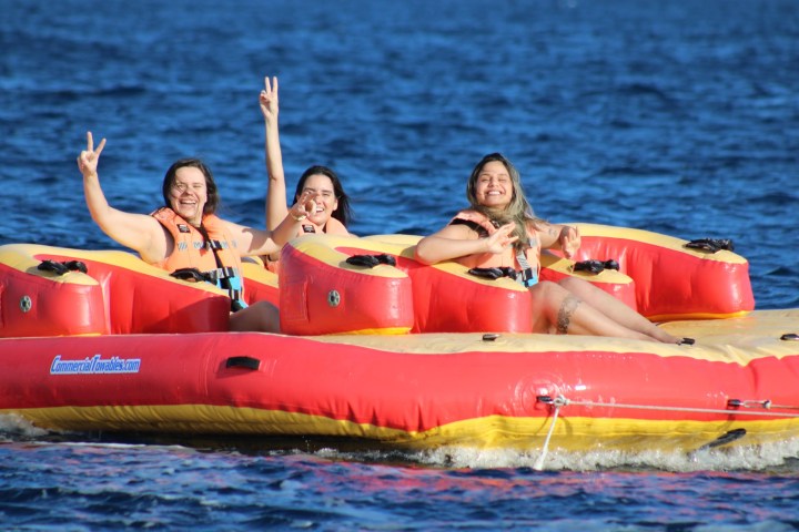 a group of people in a boat on a body of water