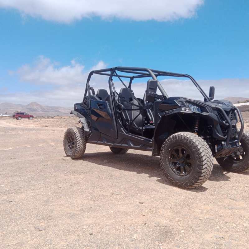 a truck driving down a dirt road