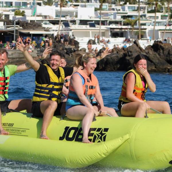 a group of people on a boat in the water