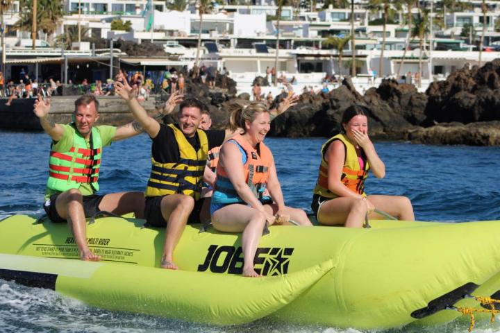 a group of people on a boat in the water